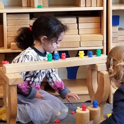 Girls Playing with Toy Bears